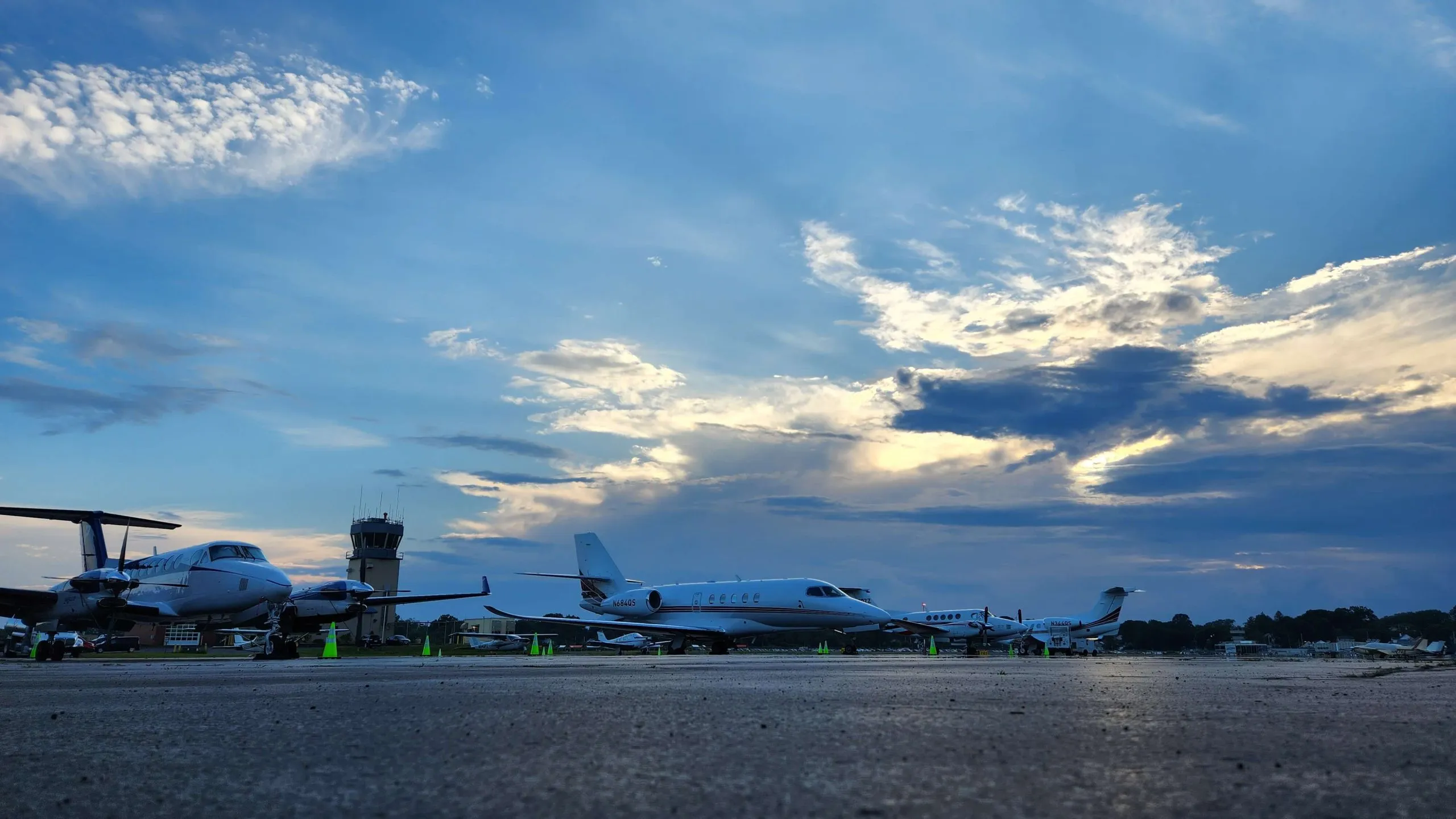 Aircraft on the ramp at Tweed New Haven Airport at dusk